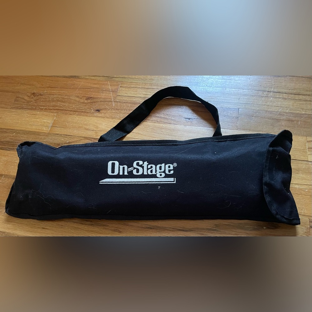 On Stage foldable music stand with carry bag.